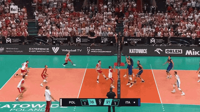 a volleyball game between poland and italy is being played in katowice