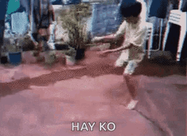 a pixelated image of a boy jumping in the air with the words hay ko below him