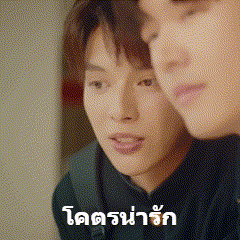 a couple of men are looking at each other with a foreign language written on the bottom .