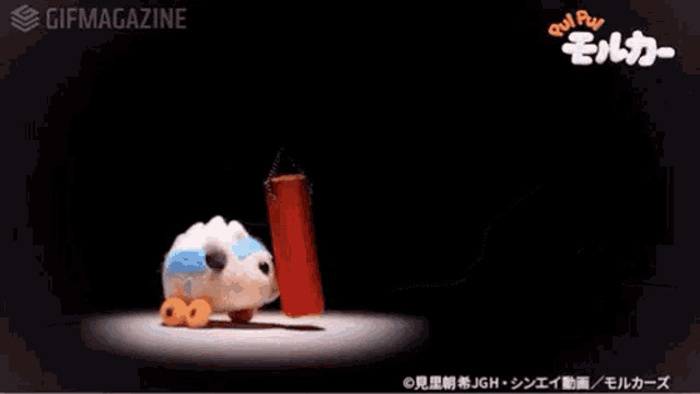 a stuffed animal is holding a barbell with the number 100 on it