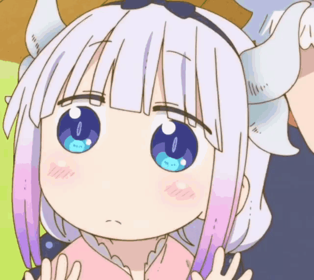 a close up of a cartoon girl with blue eyes and purple hair .