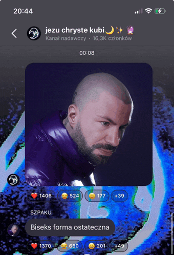 a phone screen shows a picture of a man with a beard