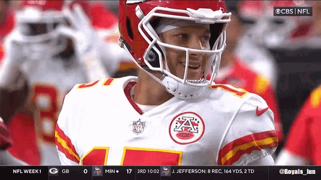 a football player wearing a helmet is on a cbs screen