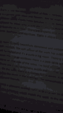 a blurry picture of a stack of books including one that says ' i 'm sorry ' on it