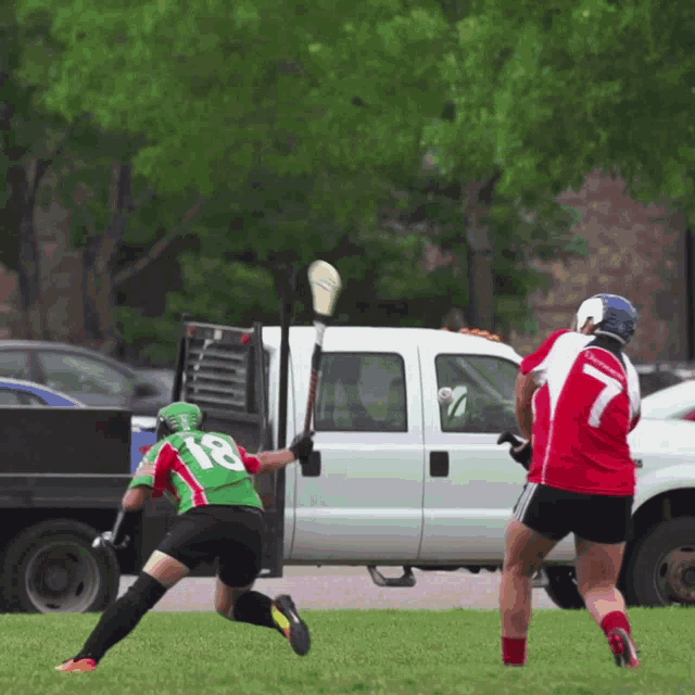 a lacrosse player with the number 18 on their jersey