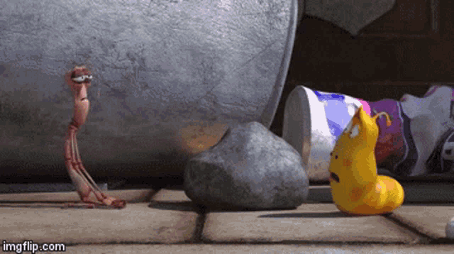 a worm and a yellow worm are standing next to each other on a sidewalk
