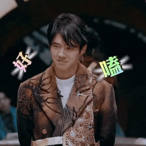 a man wearing a brown jacket with chinese characters on it