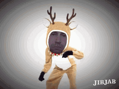 a man in a reindeer costume has a purple face on his face