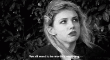 a black and white photo of a woman with a quote .