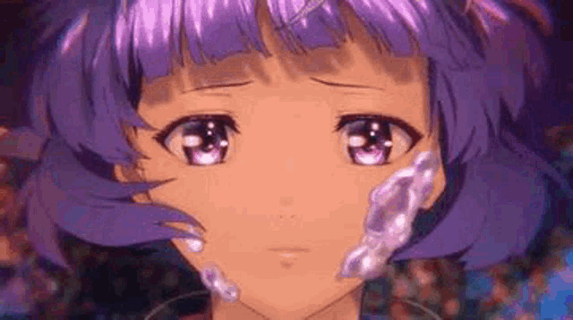 a close up of a girl with purple hair and a necklace on her neck .