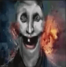 a black and white painting of a scary clown with a huge smile on his face and a fire in the background .