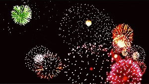 a bunch of colorful fireworks are exploding in the night sky