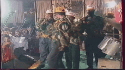 a group of men are standing in a room wearing hats with the letter n on it