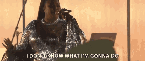 a woman singing into a microphone with the words i don t know what i 'm gonna do next to her