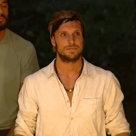 a man with a bandana on his head and a white shirt