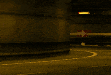 a video game scene with a car that has the number 24 on the side