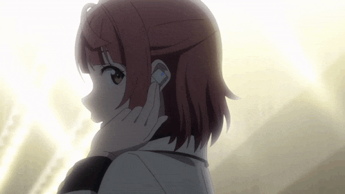 a girl with red hair is wearing headphones
