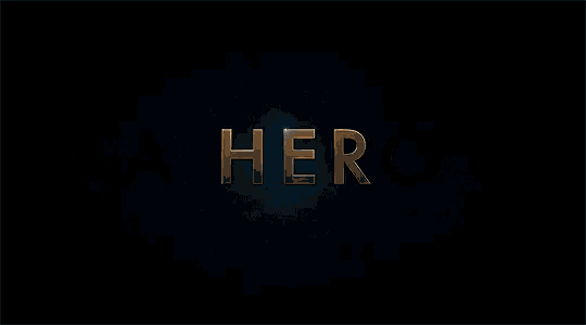 a dark background with the word a hero in gold letters