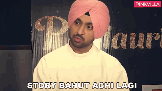 a man wearing a pink turban says " story bahut achi lagi "
