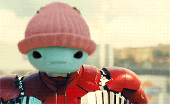 a robot wearing a pink beanie and a red jacket