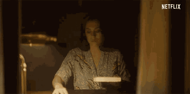 a netflix ad shows a woman reading a book and saying every story has an end