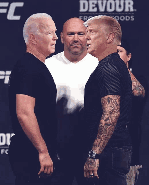 two men standing next to each other with the word devour on the back