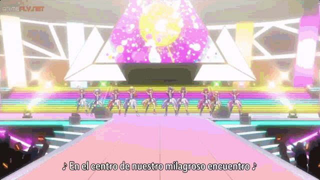 a group of people are dancing on a stage with the words en el centro de nuestro milagroso encuentro written below them
