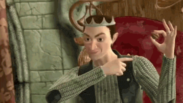 a cartoon character is sitting in a chair wearing a crown and pointing at the camera .