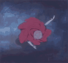 a red rose is floating in a glass bowl
