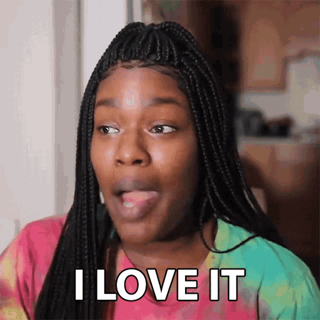a woman with braids is making a face and saying i love it