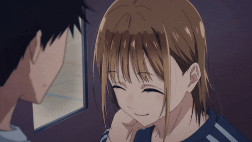 a boy and a girl are looking at each other in a dark room