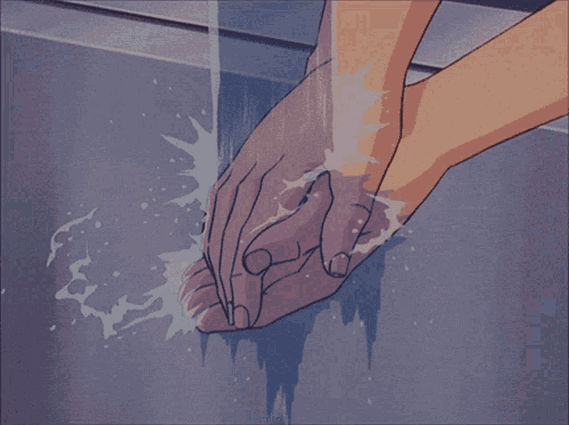a person is washing their hands in a sink