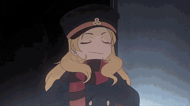 a girl with blonde hair wearing a black hat and scarf with an ampersand on it