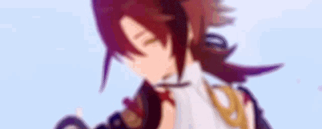 a blurry picture of a cartoon character with red hair and a sword .