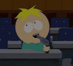 a cartoon character is sitting at a desk holding a gun