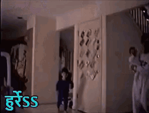 a person standing in a hallway with the word sss on the bottom right