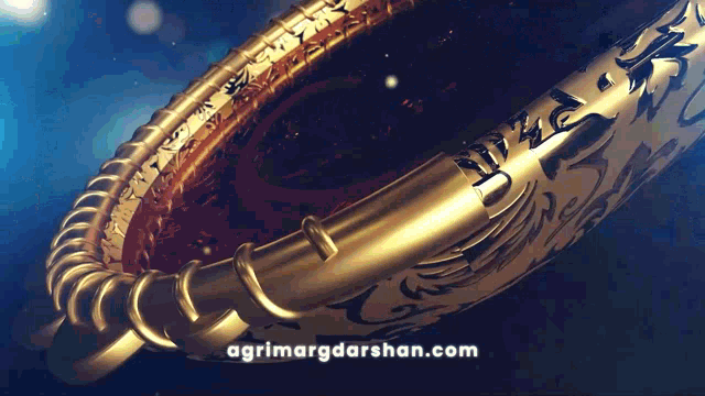 a close up of a gold object with the website agrimargdarshan.com written below it