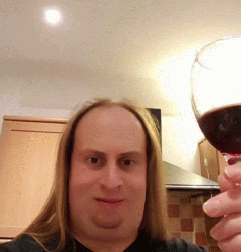 Happy Androgynous Man Drinking Wine GIF - Happy Androgynous Man Drinking Wine GIFs