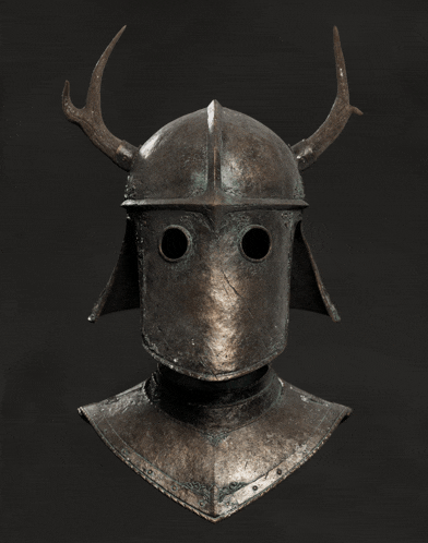 a statue of a knight 's helmet with antlers on top