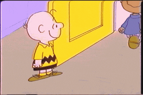 a cartoon of charlie brown shaking hands with a boy in a blue sweater