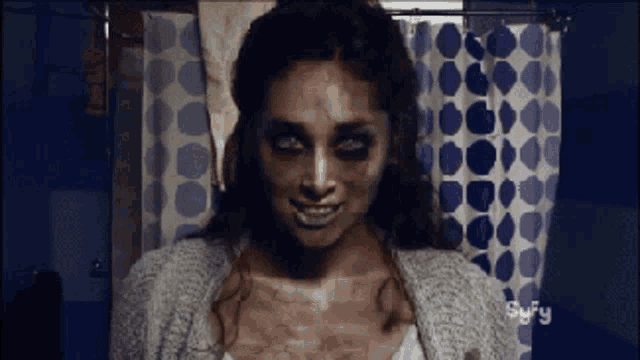 a woman with a syfy logo on the bottom of her screen