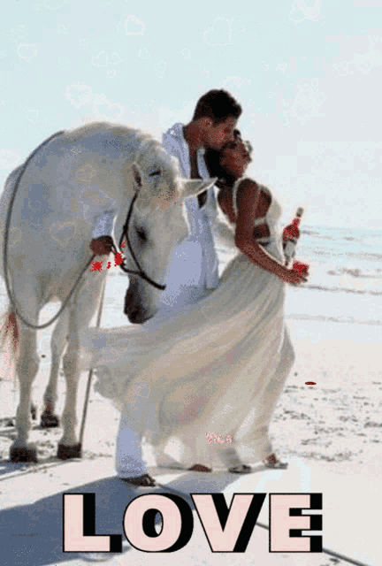 a bride and groom kissing on the beach with the word love in the corner