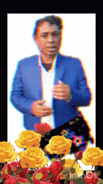 a man in a blue suit is surrounded by roses