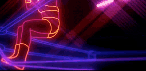 a neon sign is glowing in the dark on a dark background .
