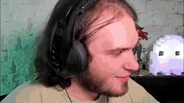 a man wearing headphones looks at something