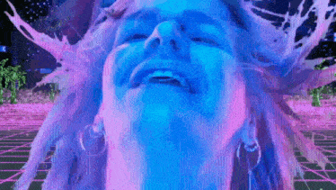 a painting of a woman 's face with purple and blue splashes coming out of it
