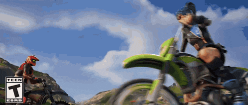 a person riding a dirt bike with a t on the bottom right