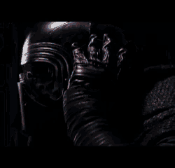 a blurry picture of a man with a mask on his face .