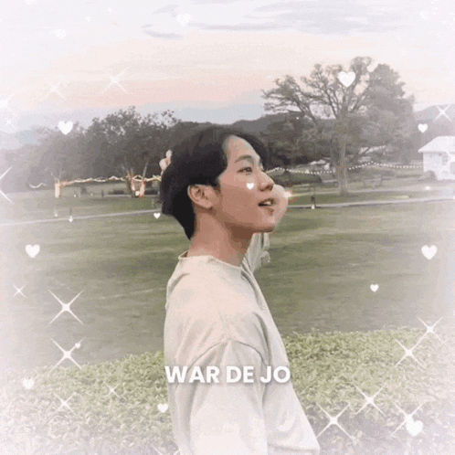 a man in a white shirt is standing in a field with the words war de jo above him