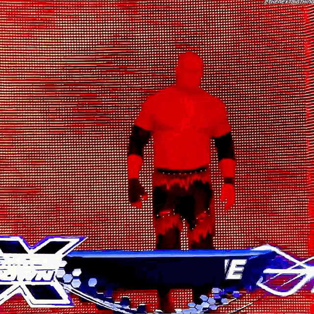 a man in a red shirt is standing in front of a screen that says wwe